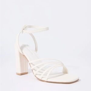 Strappy white wedge heels​